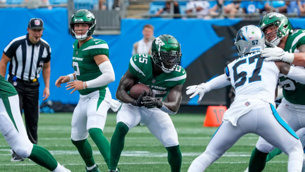 Jets' RB Israel Abanikanda (25) carries the ball against the Panthers in an NFL Preseason game